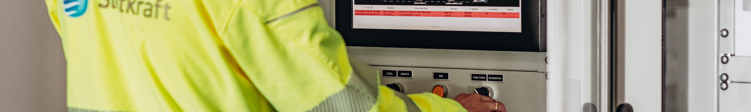 Worker in front of control panel